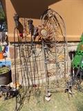 wrought iron trelllis and yard art
