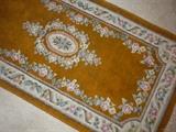 ONE OF SEVERAL ORIENTAL RUGS