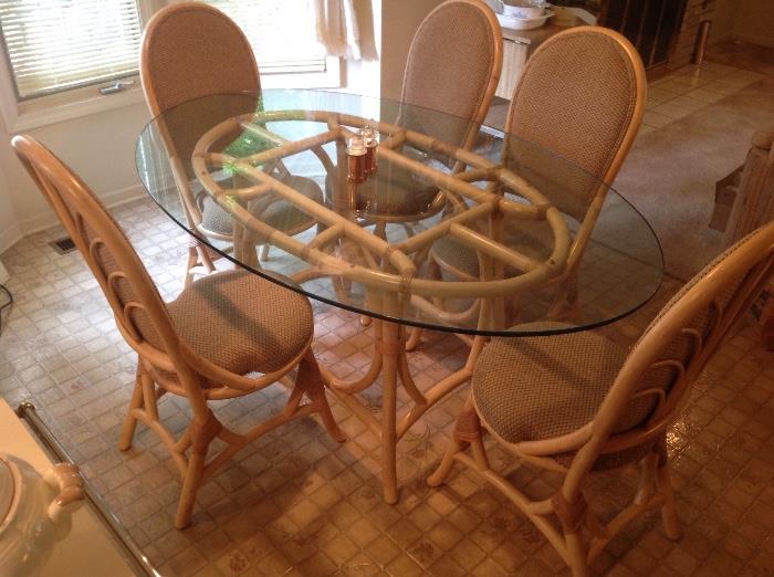 Rattan and Glass Dining Table with 5 Upholstered Chairs