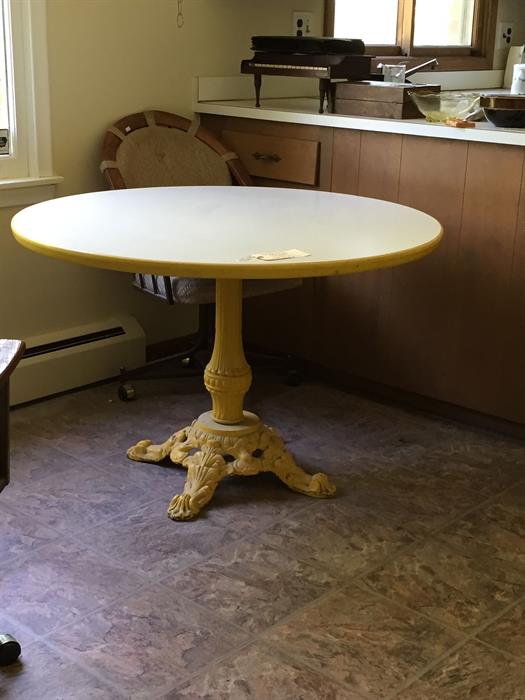 Heavy iron based pedestal table.  Great as it is, but just imagine it with a different paint job/new top!