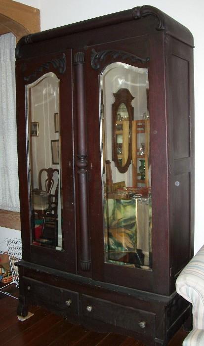 This armoire has shelves and two drawers at the bottom - nice and big - beveled mirrors - warning...it's heavy!