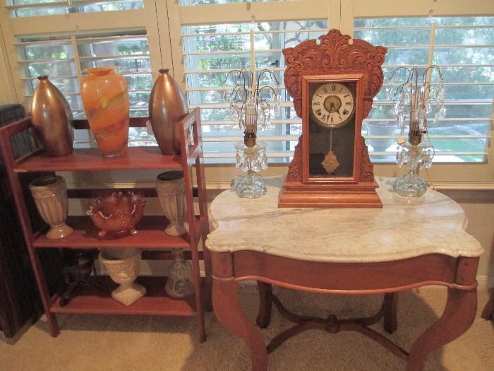 Antique marble table with crystal lamps and a William L. Gilbert Antique clock.