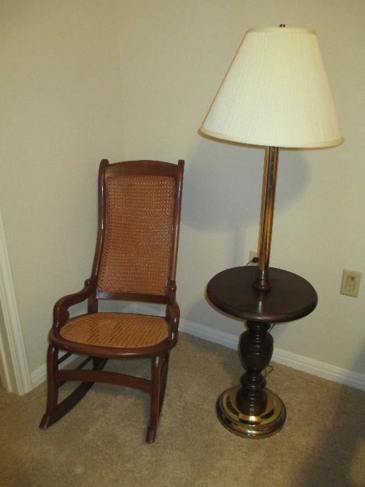 Rocker with cane table with lamp.