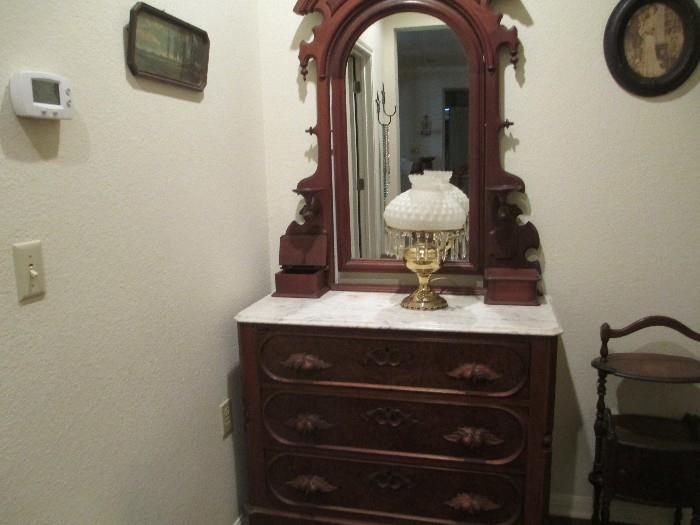 Antique marble top dresser with fabulous mirror.