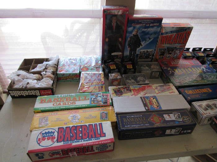 Complete factory sealed baseball card sets from the 1990's. Signed baseballs from Texas Rangers 