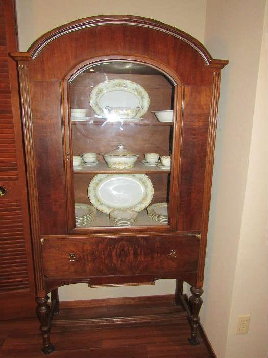 Beautiful antique display cabinet with China