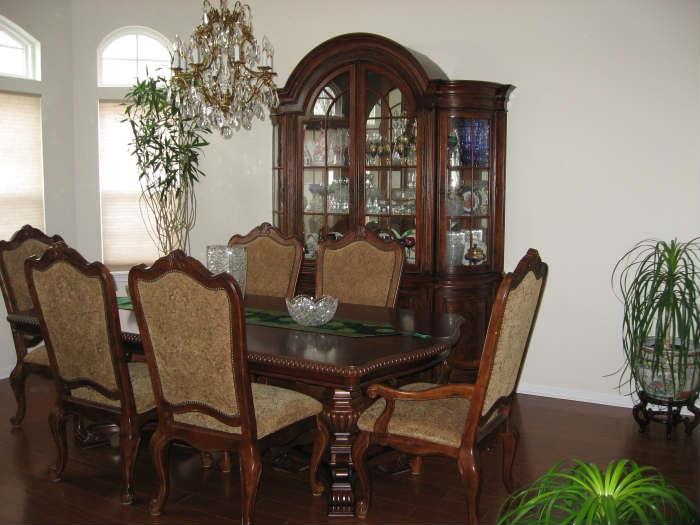 Dining table with two extensions, total 128" long. The chairs are in new condition, never used.