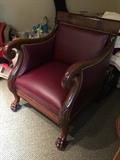 English carved mahogany arm chair w/ burgundy leather w/ lion paw feet and acanthus knees