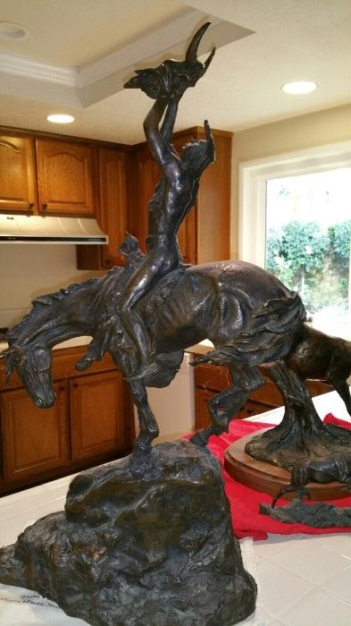 Bronze sculpture by Burk McChain
INDIAN ON HORSEBACK WITH COW SKULL, signed
H33 1/2" W19 3/4" D11 3/4"