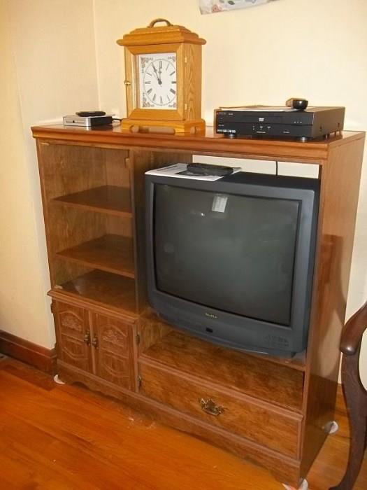 TV unit with great storage, retro clock, DVD player and Quasar TV (both have remotes and manuals).