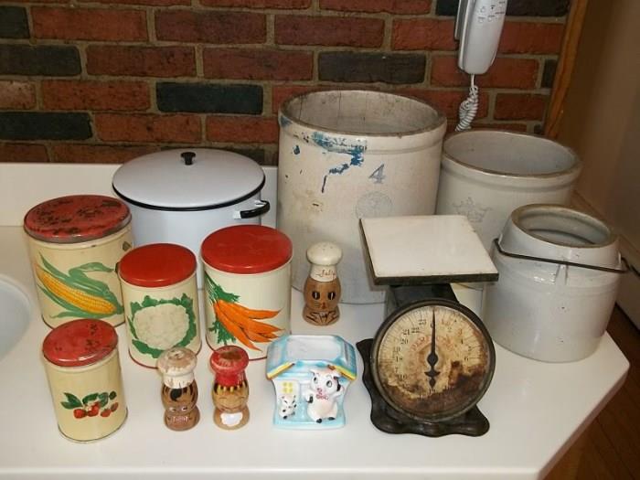 Rustic kitchen fun! Metal canister set, big enamel pot, shakers and planter, very old scale and three stoneware crocks (Atlas Stoneware of Tonica Illinois, Robinson Ransbottom and unmarked).