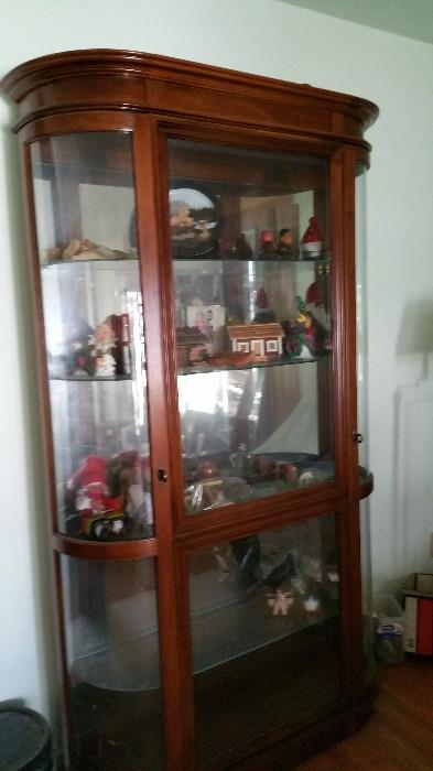 curved sides curio cabinet and curio items