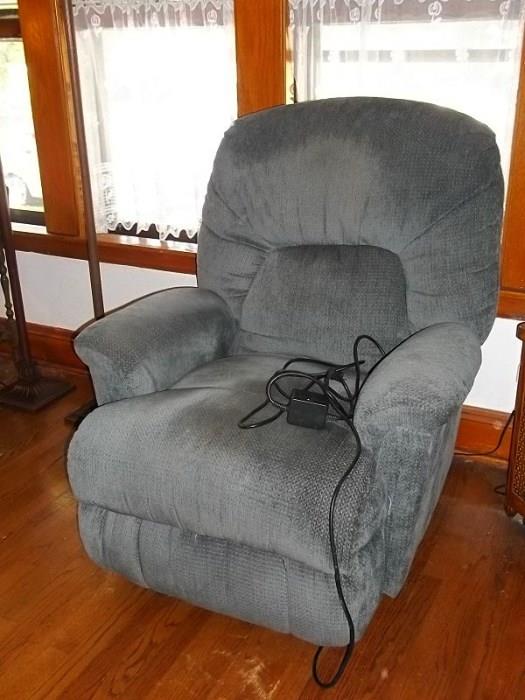 Power recliner moves to many positions with the touch of a button.