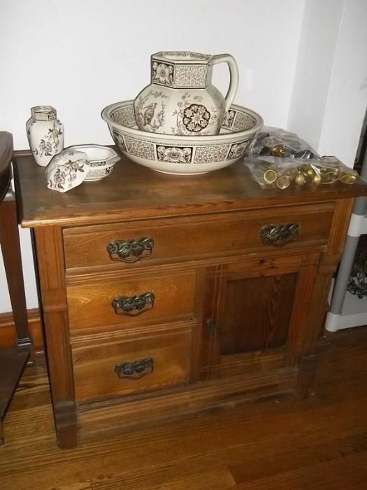 Wedgwood toilet set (has several repairs) and antique oak commode.