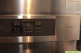Kenmore Elite Dual-Fuel 48" range - five burners, double oven. Model: 790.75503204; Vent hood is Zephyr Breeze II. Range $850; Hood $100.	