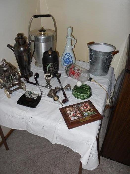 Several Jim Beam Bar Collectibles, 49-Niner Frame Footballers, Aluminum Ice Buckets, Bit "T" Keronsene Lamp, Vintage Coach carrying Shot Glasses, Golf Ball Ash Tray, Car Collectible Tray for Men's items, Gold Club Bar Collectibles, Mash Distillery Collectible Bottle