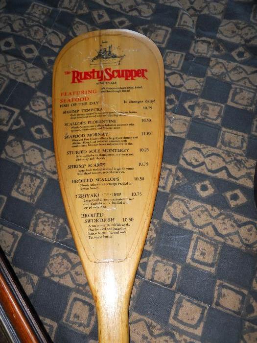 Rusty Scupper Paddle with Menu on both sides of the Paddle