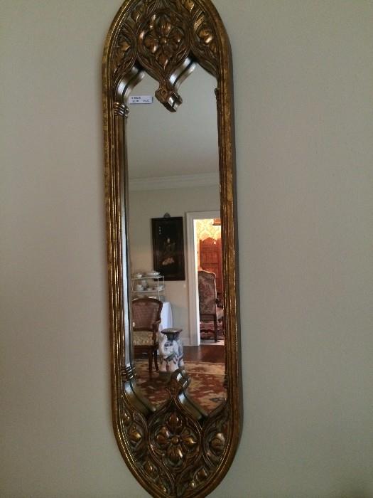                 Elongated gold mirror