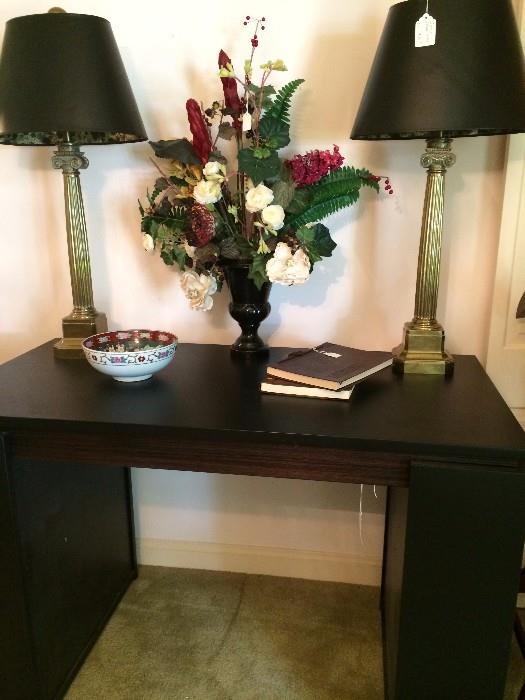  Black desk with very heavy brass lamps