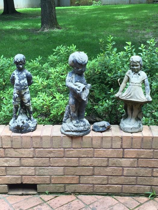       Three small yard statues