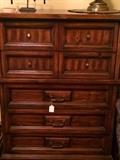 Seven drawer chest has matching headboard, dresser, and nightstand.