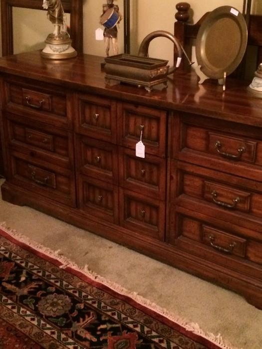 Large dresser has matching headboard, seven drawer chest, and nightstand.