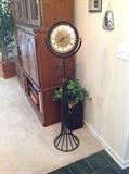 Standing metal clock (needs repair) $ 30.00