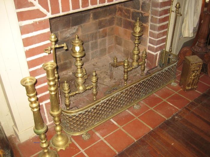 brass andirons, fender and large pair of candlesticks
