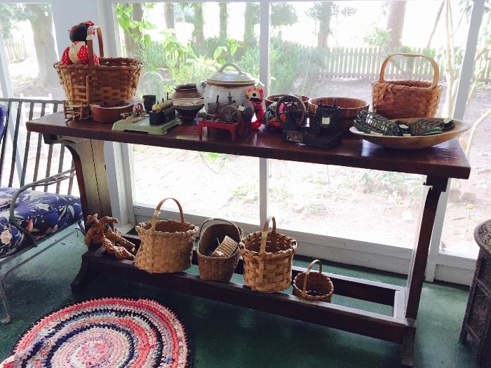 Antique toy steam engines, split oak baskets, old dough bowl