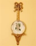 Elegant plate holder with botanically themed plate.  There's a pair of these.