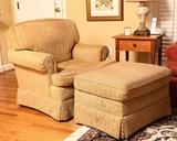 There is a pair of these very comfortable chairs with ottomans.