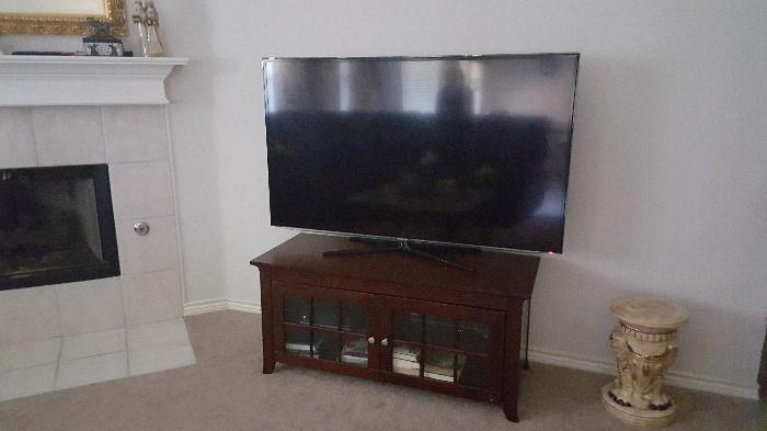 60" Samsung smart tv. Stand with glass doors available
