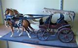 this is a vintage had made buggy, needs a little TLC, but still in nice condition.  Toy horses are plastic.