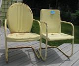 two vintage metal deck chairs.  classic 1940's
