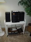 compact stereo system on rattan rolling cart