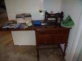 "Domestic" sewing machine in cabinet. Knee peddle for running machine.