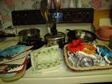 Kitchen linens and cookie cutters. Pots and pans