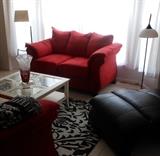 Very Nice Comfy Love Seat that has a Matching Sofa, Classic Coffee Table & Floor Lamps
