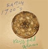 All the buttons remain on display cards as found and many have hand written notes with them such as this one stating that this button is "from the early 1700s and is very old glass". We have not added any information to the original hand written cards.