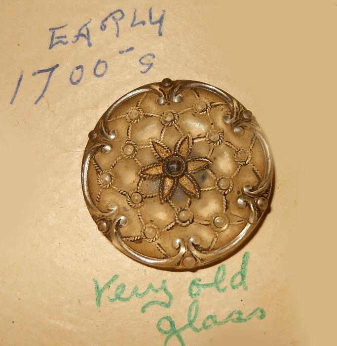 All the buttons remain on display cards as found and many have hand written notes with them such as this one stating that this button is "from the early 1700s and is very old glass". We have not added any information to the original hand written cards. 