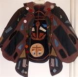 A Button Cape of course!! There are buttons under the collar as well!