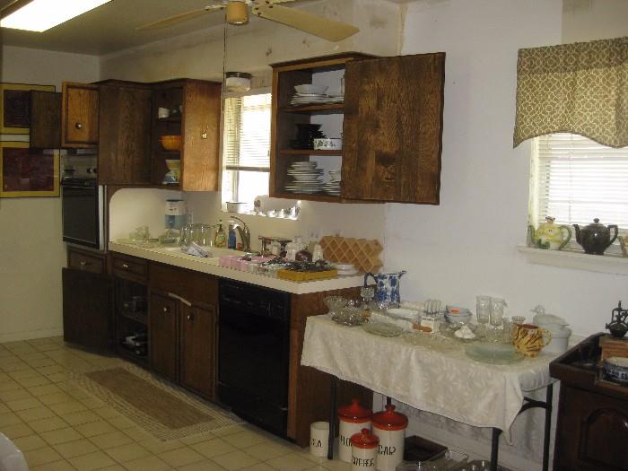 full kitchen with lots of Corning ware 