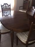 MID-CENTURY OVAL DINING ROOM TABLE WITH CANE BACK CHAIRS