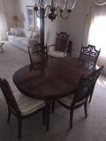 MID-CENTURY SOLID PECAN WOOD DINING ROOM TABLE WITH CANE BACK CHAIRS