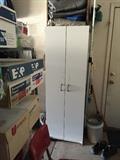 TALL WHITE STORAGE CABINET