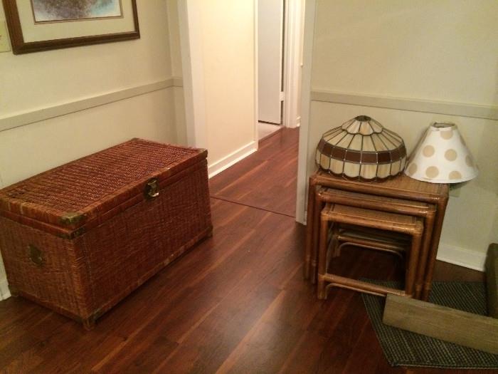 Wicker chest and nesting tables. Stained glass shade