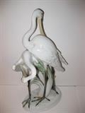 1.	Hungarian Porcelain Spoon Bills Figurine, circa1939         Appraisal Est. $375.
 Pair of porcelain Spoon Bill cranes, standing in green foliage. Marked in blue, Herend Hungary, Hand painted, and incised #5191/1 and “Herend” & “74”. Signed on the base “Roth and dated 1939. Measures 15-1/4” tall x 7-1./2 wide, by 6-1/4” deep.
