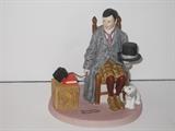 30.	Norman Rockwell Figurines, circa 1980.     Appraisal Est.  $200 each
This is a collection of12 Norman Rockwell figurines, produced by the Danbury Mint as a limited edition series in 1980. They are cast porcelain and painted in great detail. 
