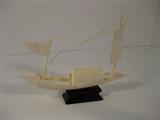 76.	Bone Carved Chinese Junk, circa 1950  Pre-sale Est. $100
This small bone carved Chinese Junk, is highly detailed with sails, masts, etc. it measures about 5” wide and 3-1/2” tall.

