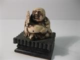79.	Small Carved Ivory Buddha, circa 1930.  Pre-sale Est. $200
This is an ivory hand carved Buddha, measures about 1-7/8” high

